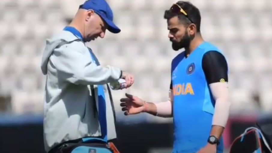 Patrick Farhart treating Virat Kohli